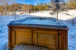 Soak in the private hot tub after a day on the slopes
